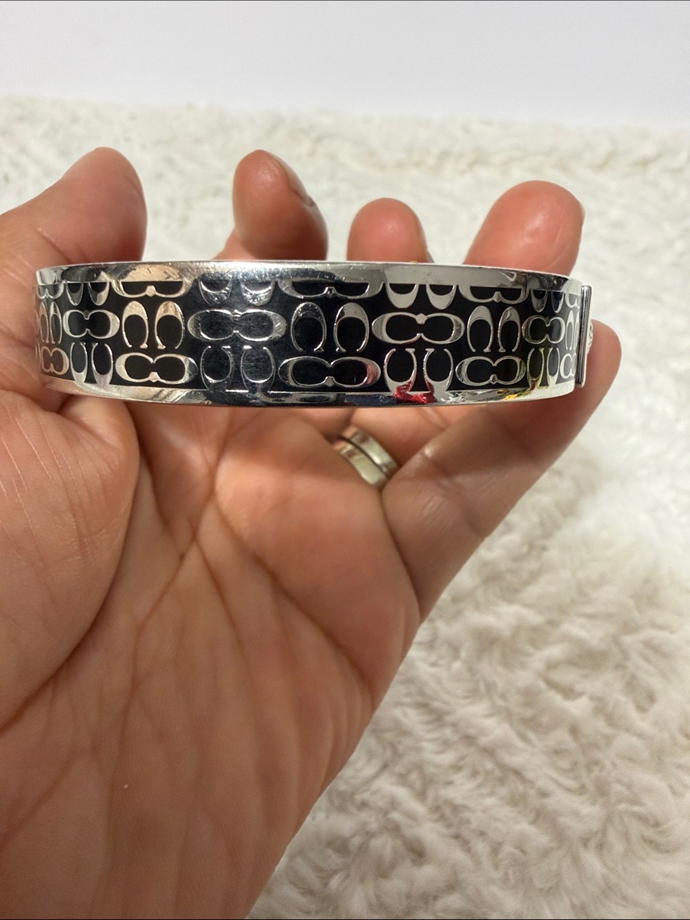 Coach Silver-Tone Signature Pattern Bangle Bracelet